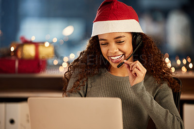 Buy stock photo Christmas hat, call center and female agent working overtime in office at night in festive. Laptop, contact us and woman customer support consultant with online crm consultation with headset on xmas.