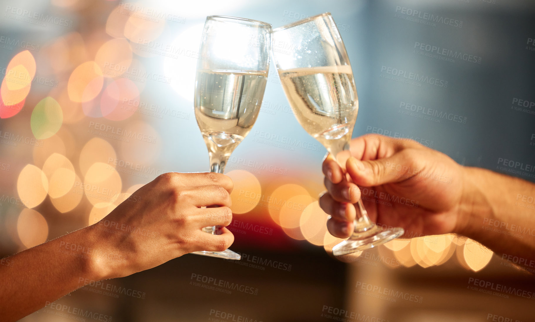 Buy stock photo Shot of two unrecognizable people having champagne during a celebration