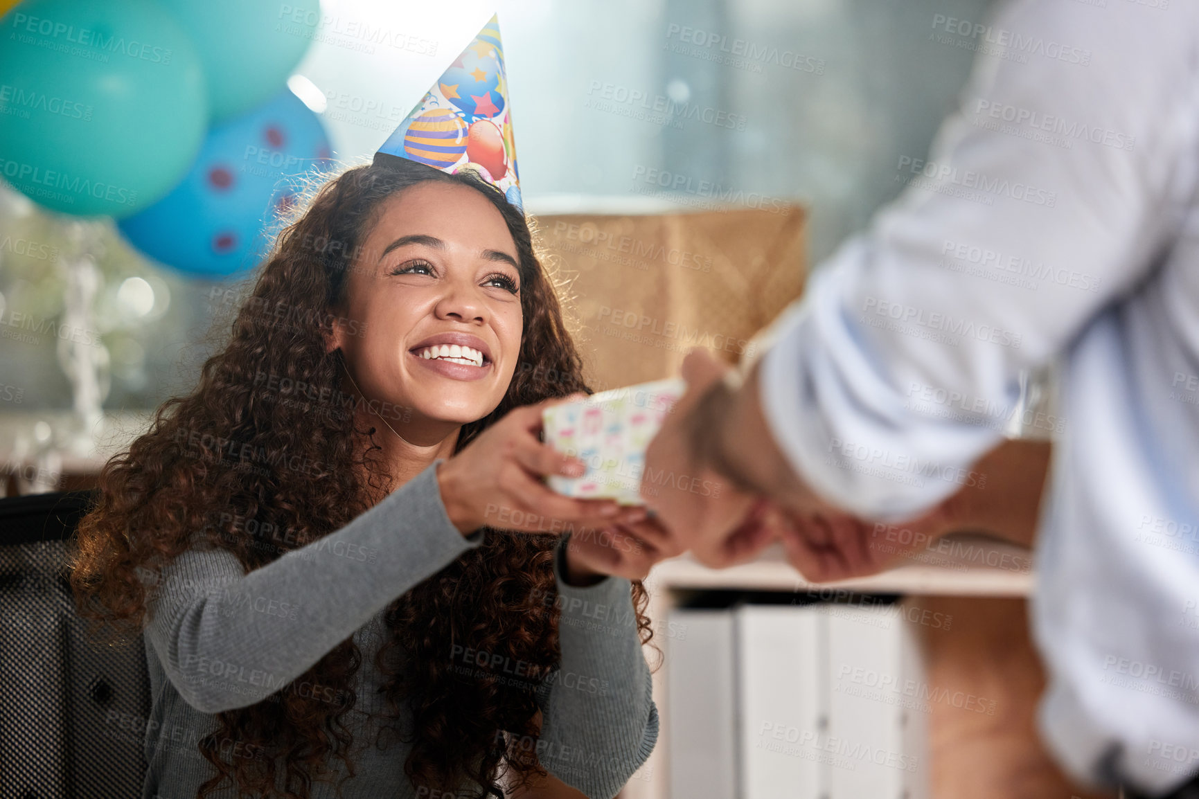 Buy stock photo Shot of two young businesspeople celebrating a birthday at work