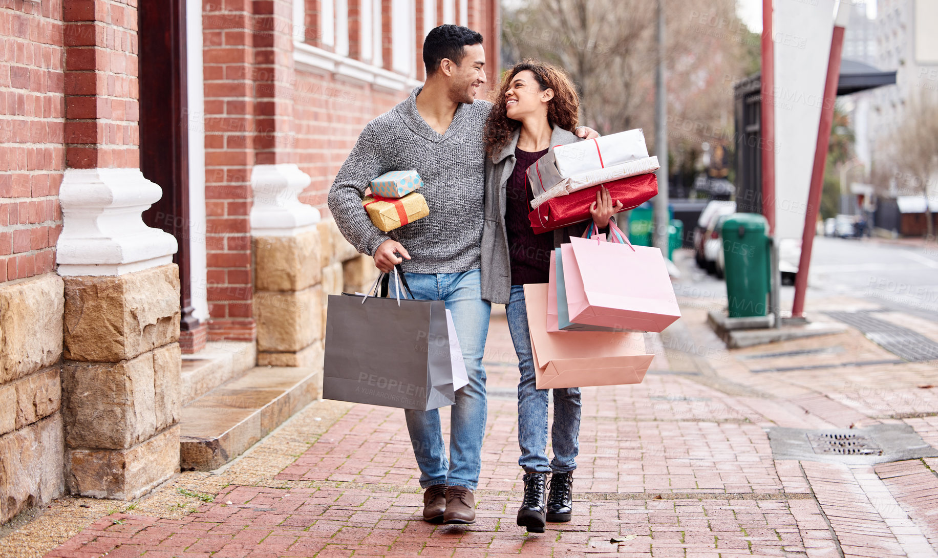 Buy stock photo Happy couple, shopping bags and walking in city with gifts for fashion, clothing or buying outdoors. Man and woman in relationship with smile for customer discount, purchase or payment in urban town