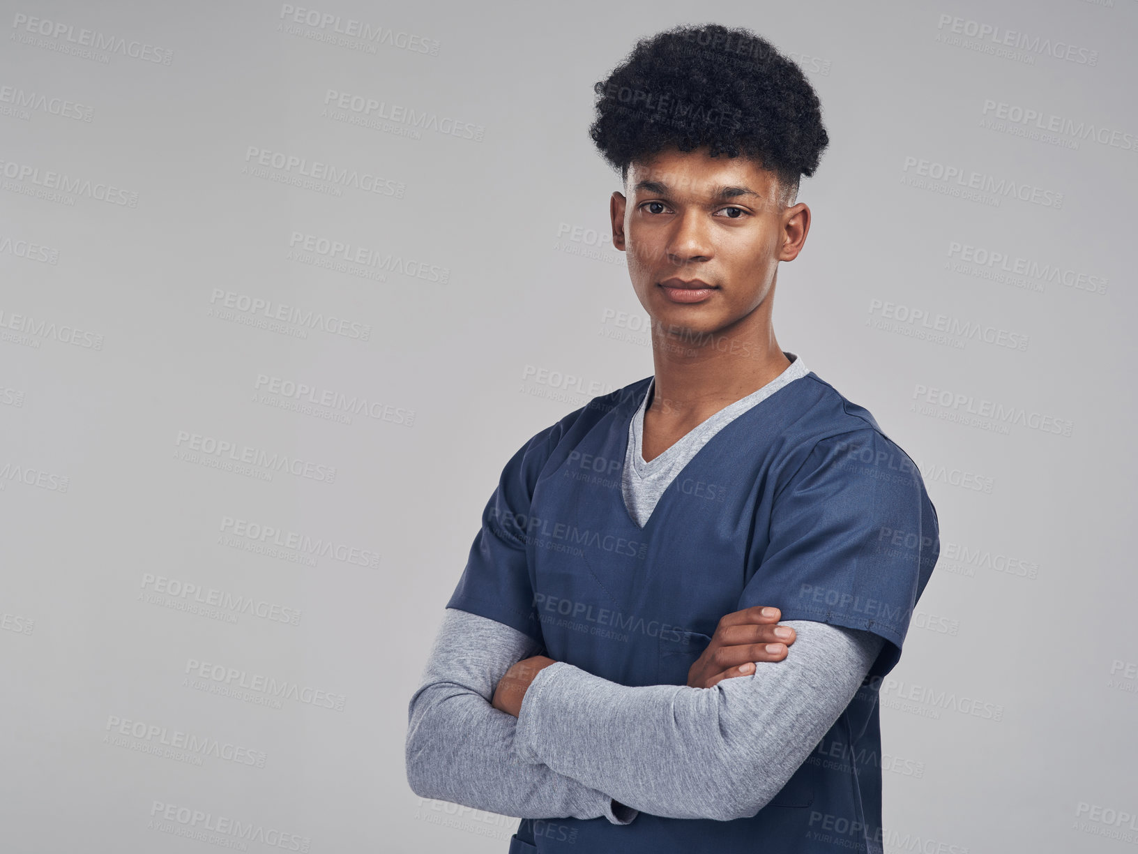 Buy stock photo Shot of a medical practitioner standing against a grey background