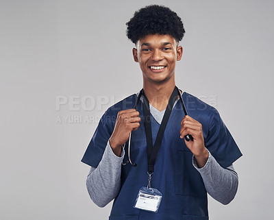 Buy stock photo Shot of a medical practitioner standing against grey background