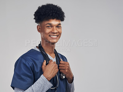 Buy stock photo Shot of a male nurse posing with a stethoscope around his neck