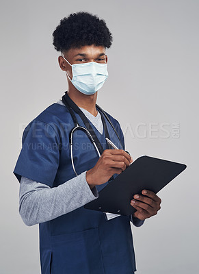 Buy stock photo Shot of a male nurse showing the ok sign while wearing a surgical mask