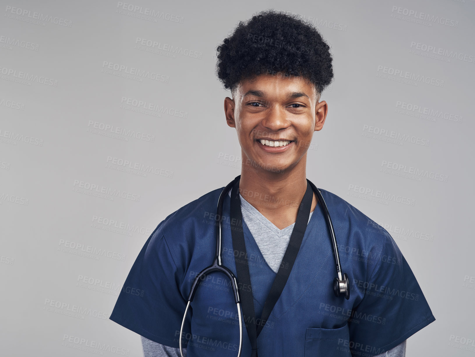 Buy stock photo Shot of a male nurse posing with a stethoscope around his neck