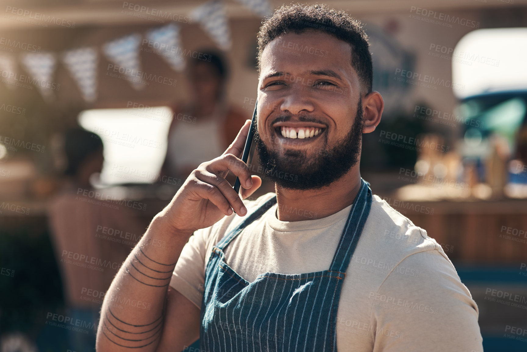 Buy stock photo Shot of a business owner using his smartphone to make a call