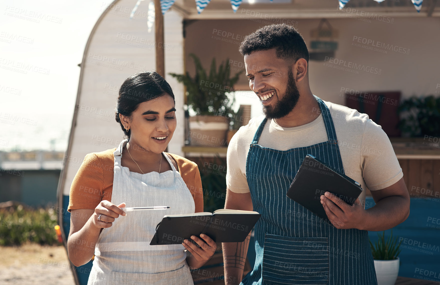 Buy stock photo Shot of two a businessman planning for the day with his staff