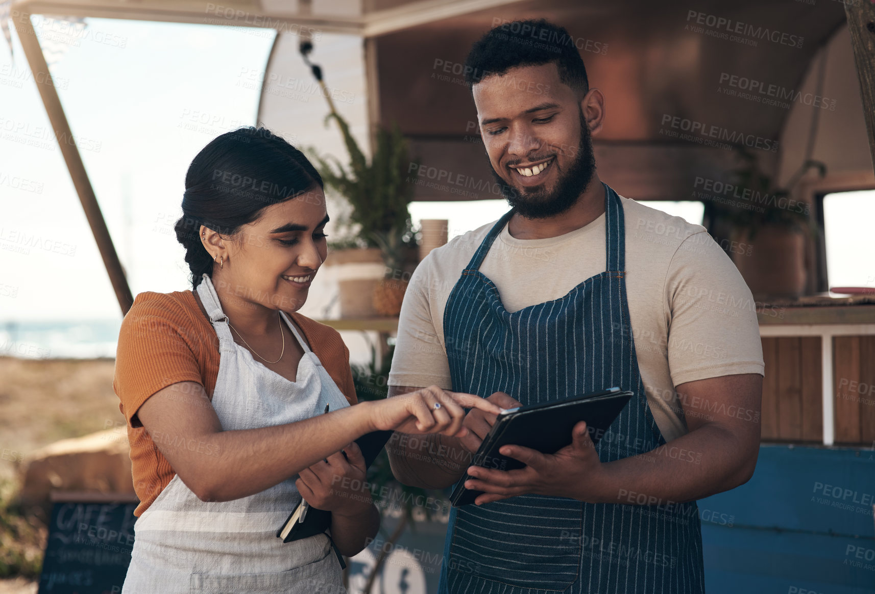 Buy stock photo Shot of two a businessman planning for the day with his staff