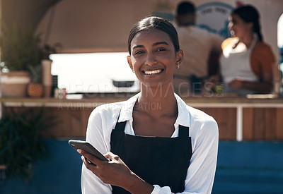 Buy stock photo Shot of a business owner using her smartphone to send a text