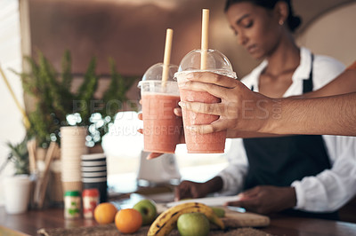 Buy stock photo Shot of a businesswoman giving a customer their smoothies
