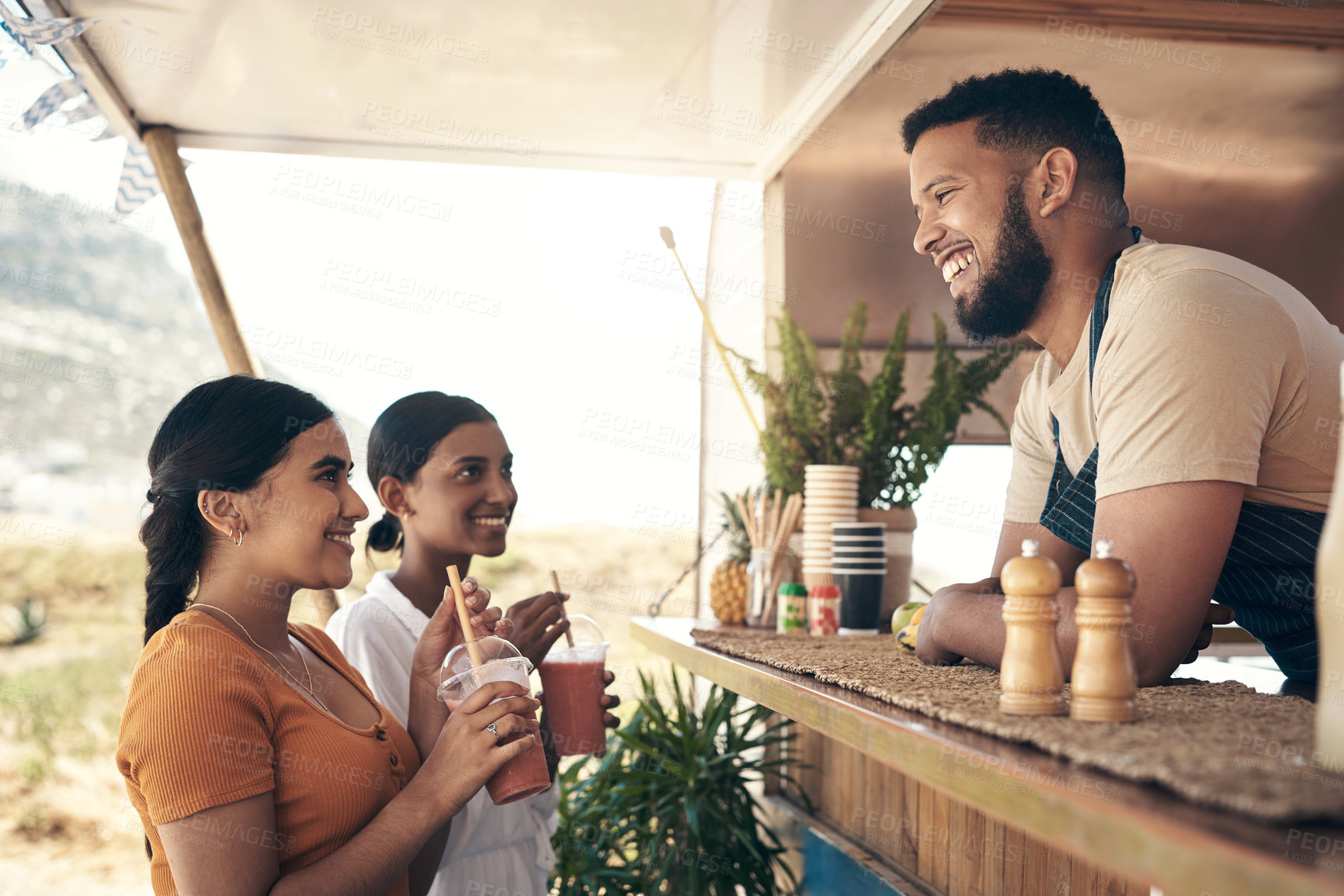 Buy stock photo People, smile and customer service at food truck with drinks, order and assistance for catering startup. Small business owner, talk and women at takeaway restaurant with smoothie, hospitality or help