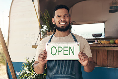 Buy stock photo Shot of a businessman holding an open business sign