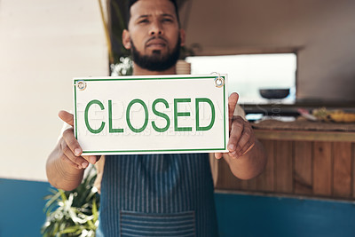 Buy stock photo Shot of a businessman holding an open business sign