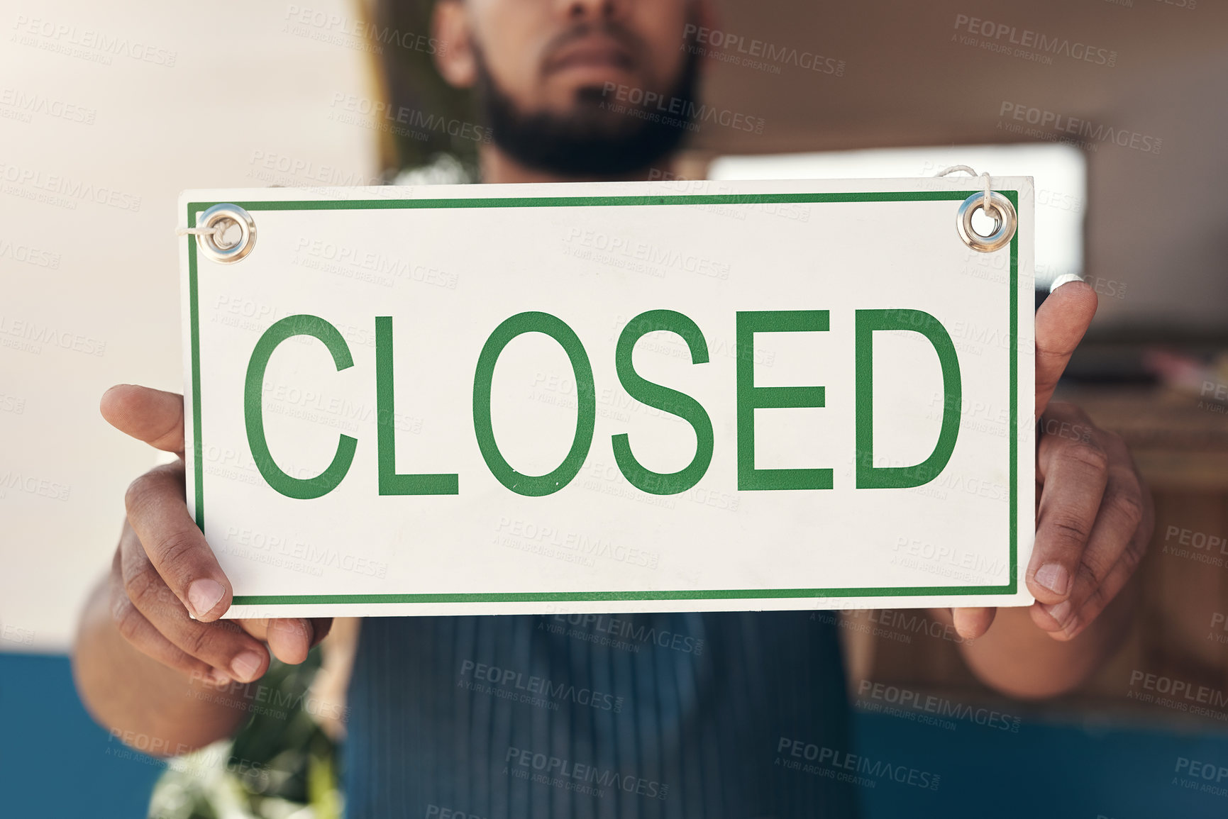 Buy stock photo Shot of a businessman holding an open business sign