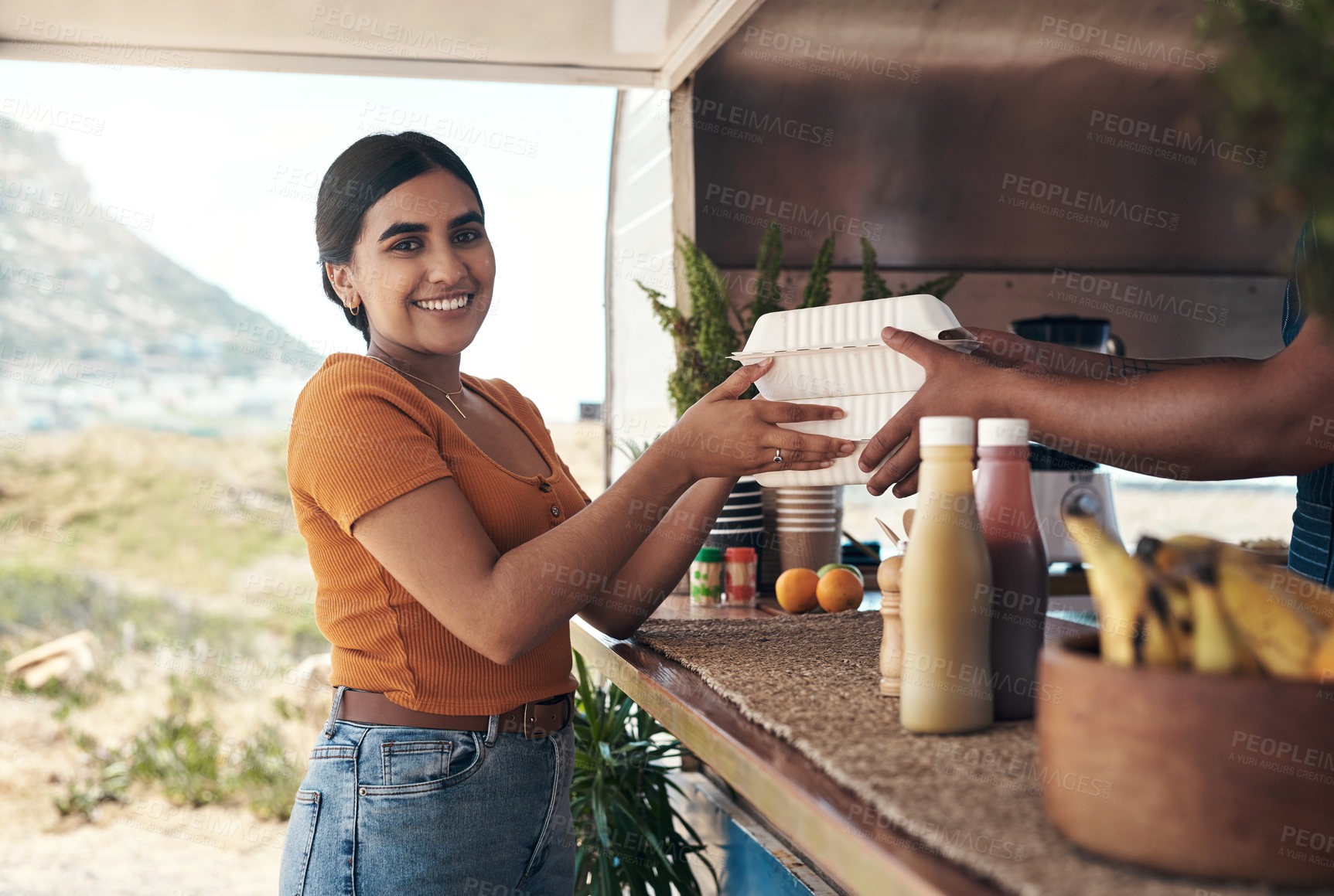 Buy stock photo Shot of a customer receiving their food order