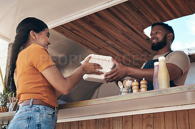 Buy stock photo Shot of a customer receiving their food order