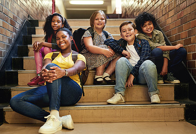 Buy stock photo Full length shot of a diverse group of children sitting together on the staircase at school