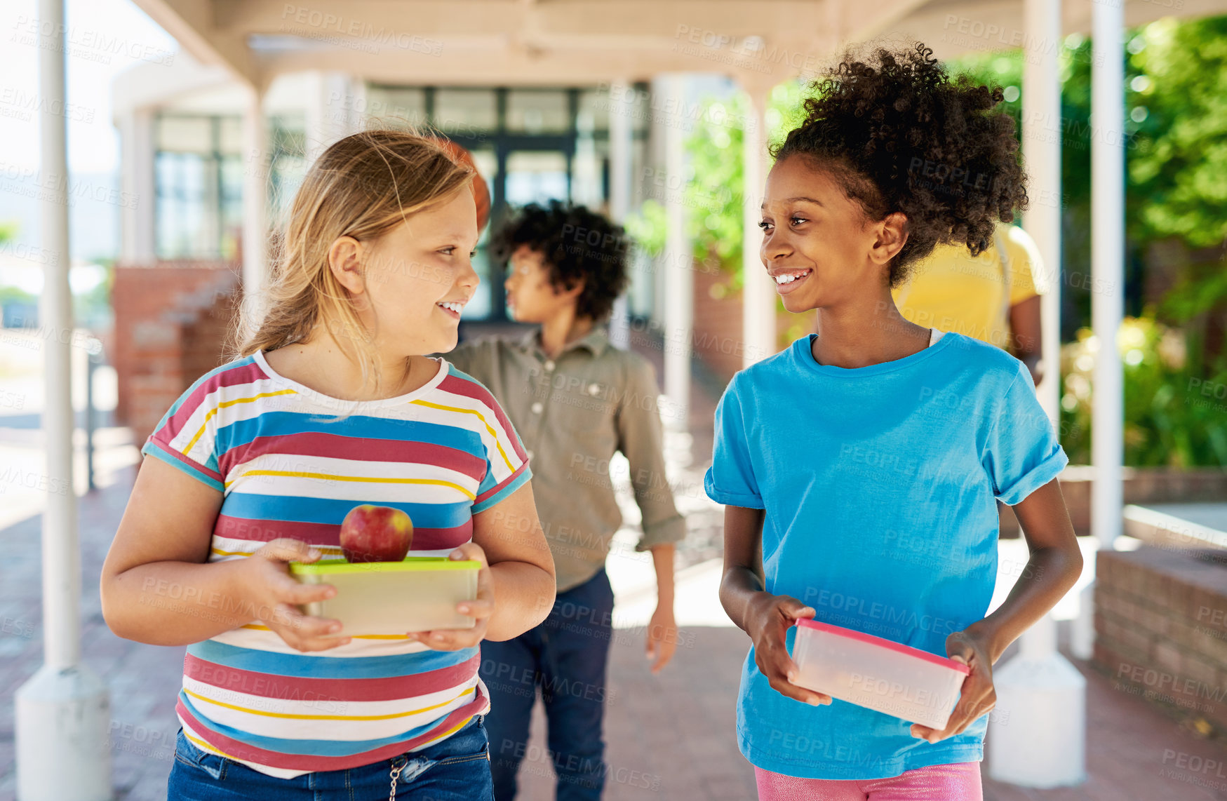 Buy stock photo Happy, children and walk at school with lunch break, friends bonding together and education for growth. Girl, students and recess at academy with food container, nutrition or learning for development