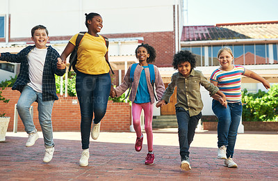 Buy stock photo Full length shot of a diverse group of children skipping outside during recess at school