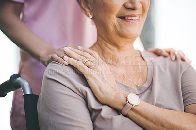 Buy stock photo Cropped shot of a nurse caring for an older woman in a wheelchair