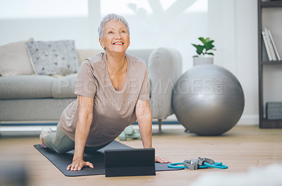 Buy stock photo Shot of an older woman doing light floor exercises at home