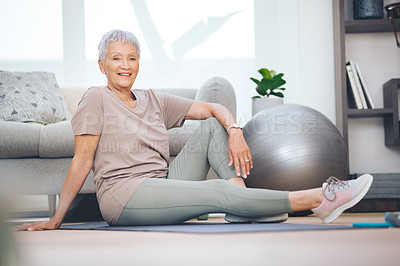Buy stock photo Portrait of an older woman taking a break from exercising at home