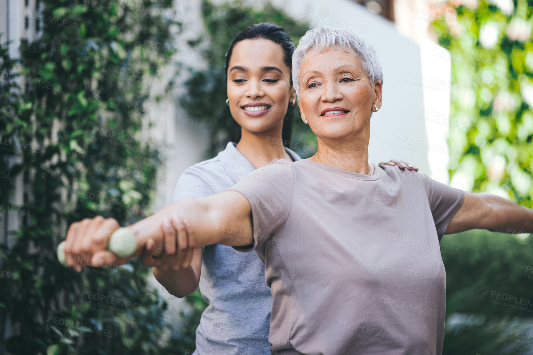 Buy stock photo Physiotherapy, weights and nurse with old woman outdoor for strength, wellness and consulting. Home, physical therapist and elderly patient with dumbbell for arthritis, mobility exercise and support