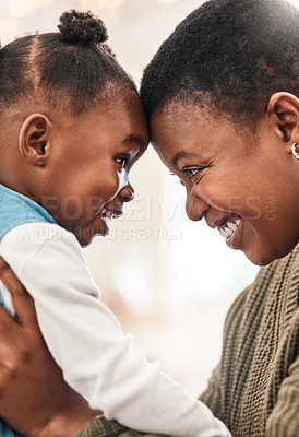 Buy stock photo Shot of an adorable little girl spending quality time with her mother at home