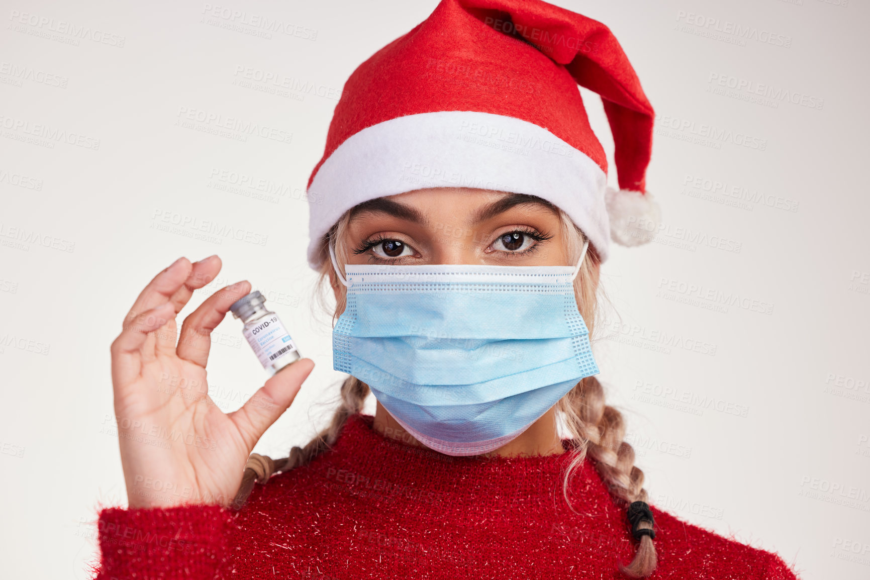 Buy stock photo Christmas, mask and portrait of woman with vaccine or virus cure isolated on white background in studio. Sick, safety and face of female person holding antivirus medicine, bottle or vial for drugs