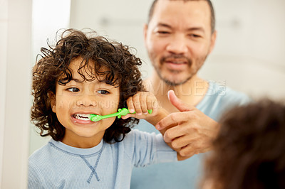 Buy stock photo Child, brushing teeth and father learning in a bathroom with dental health and cleaning. Morning routine, toothbrush and kid with dad together showing hygiene care at a mirror at home with grooming