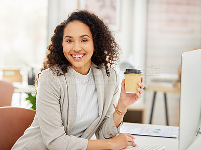 Buy stock photo Portrait of a young businesswoman drinking coffee while working in an office
