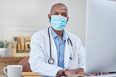 Buy stock photo Face mask, portrait and black man doctor with computer in hospital office for medical telehealth. Safety, typing and African healthcare worker with facial cover to prevent germs working in clinic.