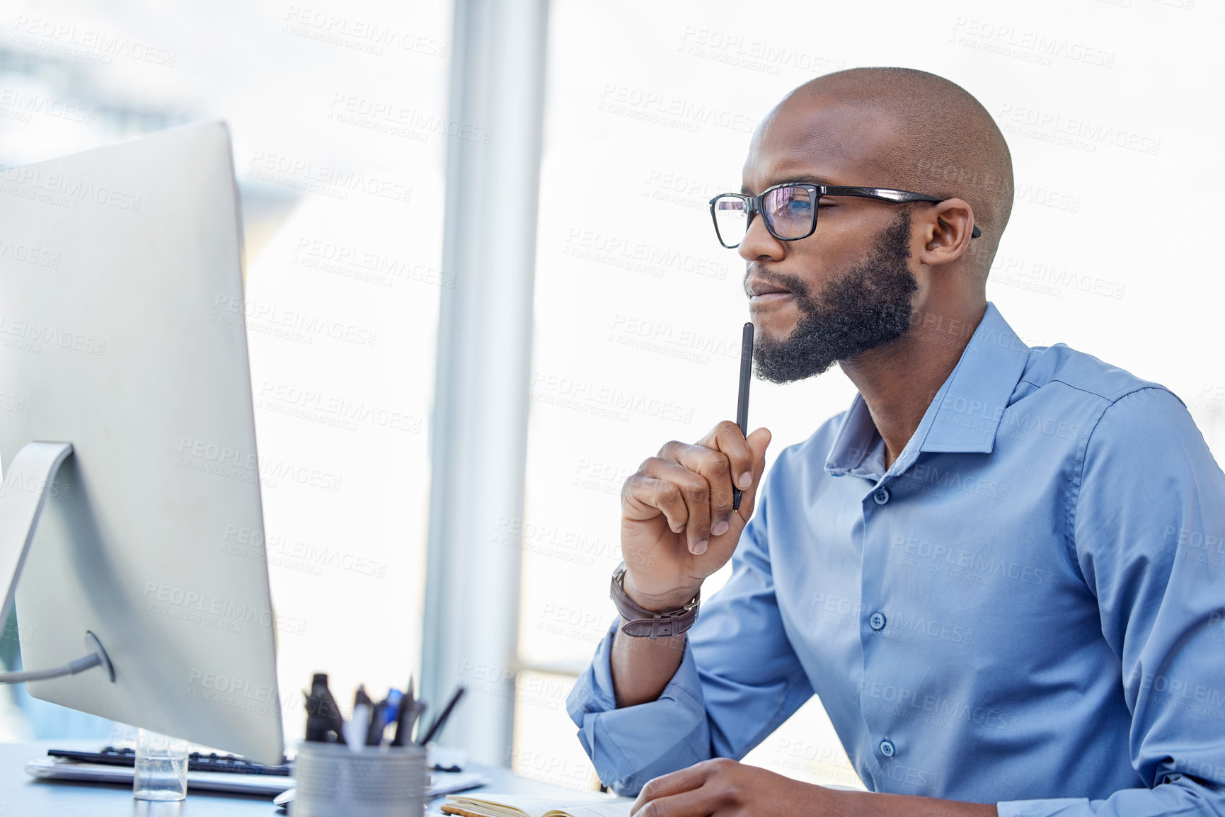 Buy stock photo Computer, thinking and black man in office for planning, problem solving or business agent reading email online. Desktop, idea or serious professional with decision, doubt or inspiration for solution