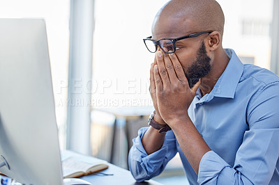 Buy stock photo Mental health, businessman with stress and with computer at his desk of his office workplace. Anxiety or depressed, problem or mistake and burnout male person at his pc at his modern workspace 