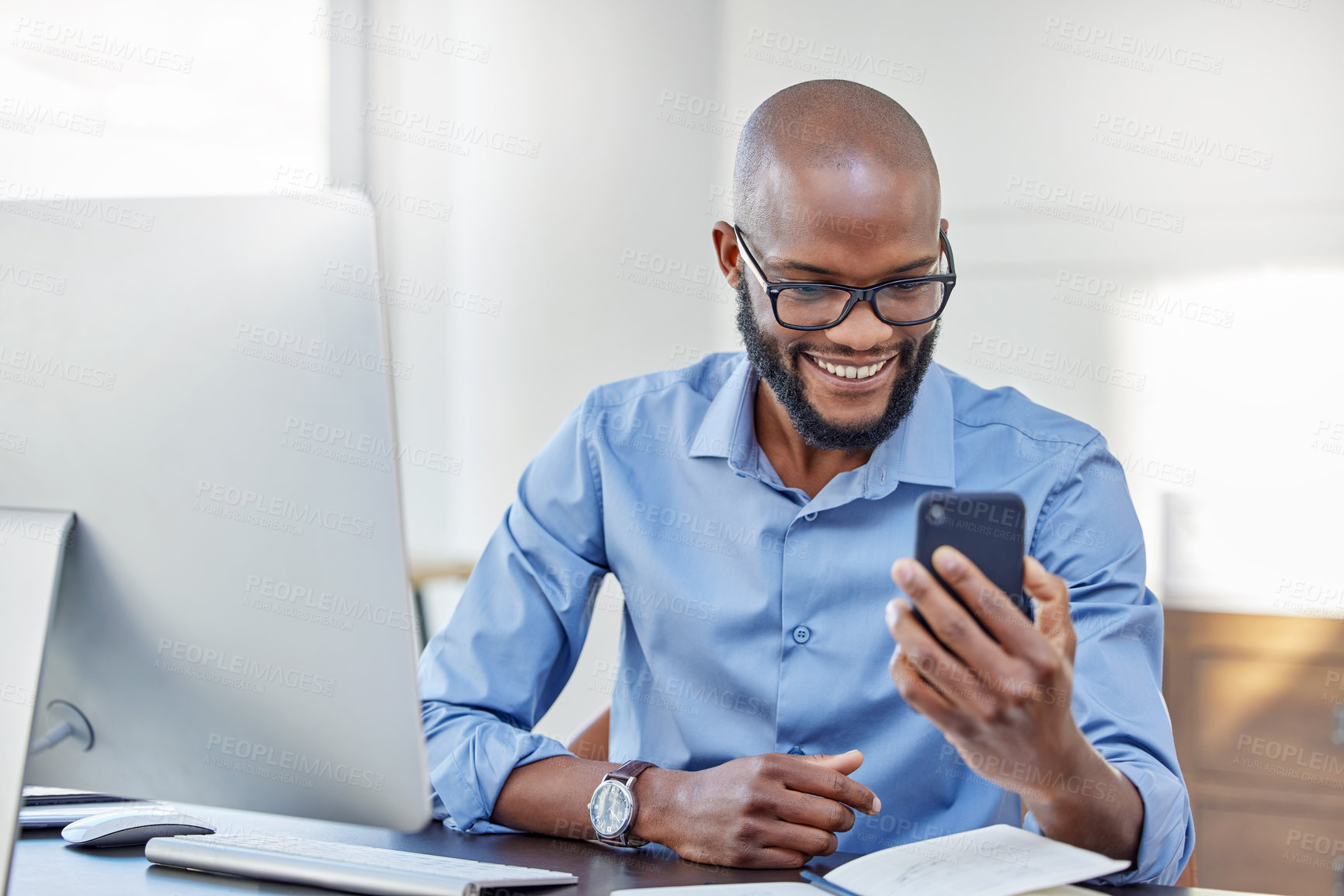 Buy stock photo Black man, smartphone and happy in office with online research or news update for article and information as journalist. Male employee, desk and smile with internet networking or social media