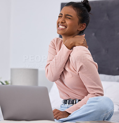 Buy stock photo Woman, laptop and pain in neck on bed for online streaming with muscle injury, internet video and bad posture. Indian person, tech and shoulder with tension in bedroom for home, web and stress