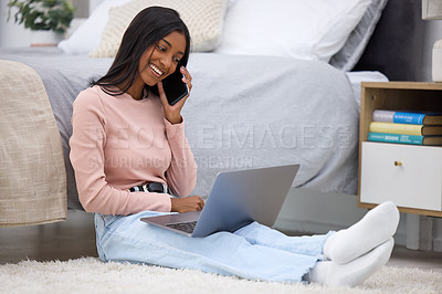 Buy stock photo Full length shot of an attractive young woman making a phonecall while using her laptop in the bedroom at home
