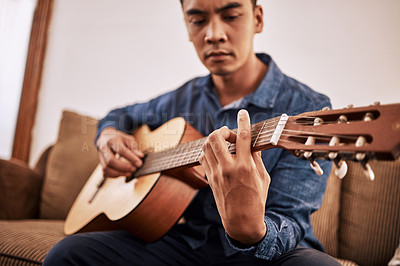 Buy stock photo Man, guitar and sofa in house as student with talent for music, performance and jazz band. Musician, instrument and couch in home learning sound for concert, audition and career as creative artist
