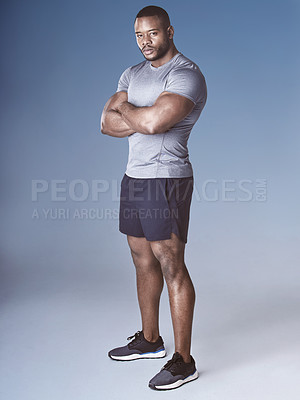 Buy stock photo Black man, portrait and arms crossed for fitness in studio, wellness and strong on blue background. Male person, athlete and proud bodybuilder for training, confident and ready for workout challenge