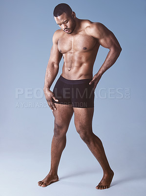 Buy stock photo Black man, underwear and confident for fitness in studio, wellness and strong on blue background. Male person, athlete and proud bodybuilder for training, exercise and ready for workout challenge