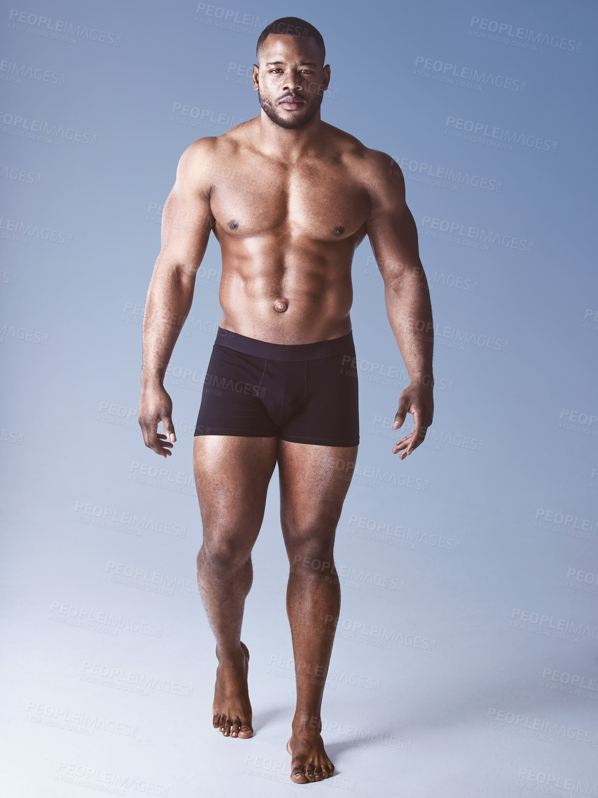 Buy stock photo Black man, portrait and serious for bodybuilding in studio, wellness and strong on blue background. Male person, muscle and proud athlete for training, exercise and results of workout challenge