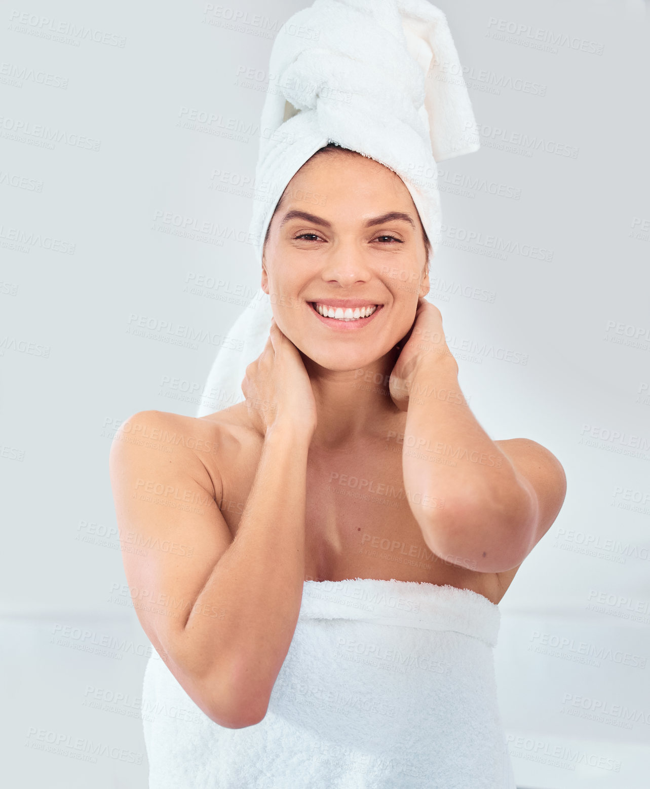 Buy stock photo Portrait, woman and towels in bathroom for shower, skincare and refreshed from bath at home. Spa treatment, luxury and female person with smile for wellness, cleaning or soft skin on white background