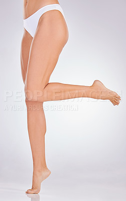 Buy stock photo Studio shot of an unrecognisable woman’s beautiful legs against a grey background