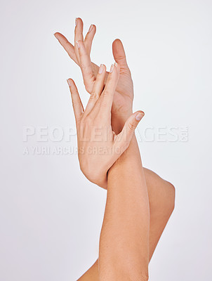 Buy stock photo Woman, hands and manicure or nails in studio, skincare and twist for cosmetics on white background. Female person, pamper and grooming treatment or health, beauty polish and dermatology wellness