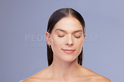 Buy stock photo Woman, calm and skincare in studio for beauty, facial treatment and cosmetics on blue background. Female person, healthy and pamper for dermatology, grooming and confident for mockup space or clean