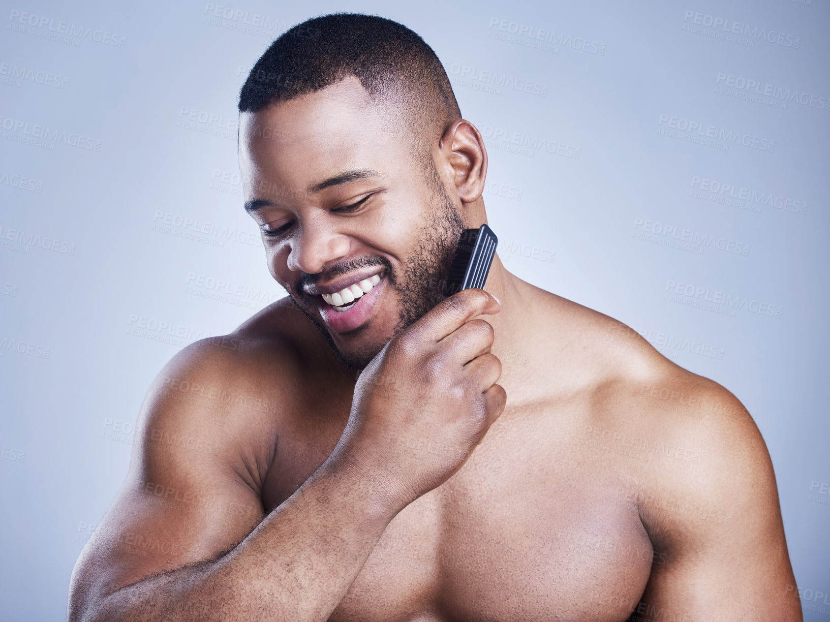 Buy stock photo Black man, beard comb and grooming in studio, confident and haircare on blue background. Male person, brushing and maintenance for hygiene routine or cleaning, beauty and hair treatment for cosmetics