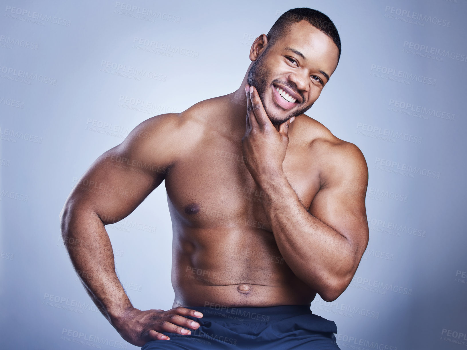 Buy stock photo Black man, portrait or skincare in studio with cosmetics for smooth skin, facial treatment or morning routine. Model, person or topless with smile for wellness, selfcare or hygiene on blue background