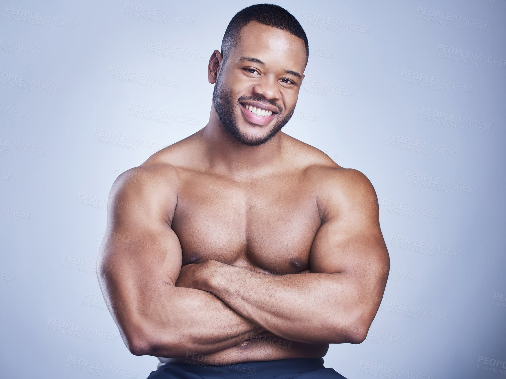 Buy stock photo Black man, arms crossed and topless in studio with fitness for healthy body, portrait and muscle with confidence. Bodybuilder, athlete or happy with wellness, arm strength or power on blue background