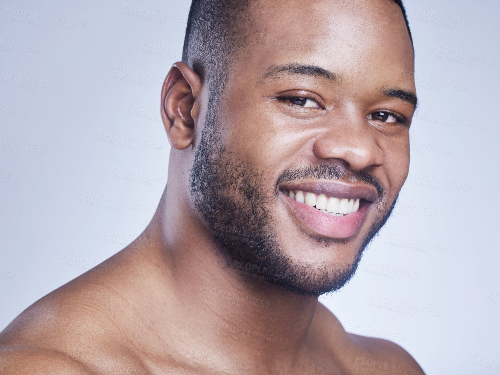 Buy stock photo Black man, happy and skincare in studio portrait, facial treatment and cosmetics on blue background. Male person, healthy and pamper for dermatology, grooming and confident for smooth or clean skin