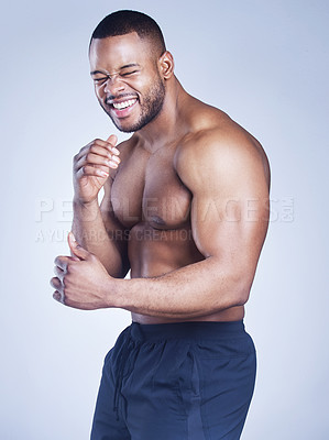Buy stock photo Studio shot of a handsome young man boxing against a blue background